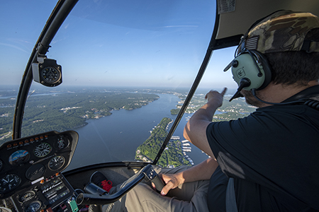 Max enjoying the aerial view of the Lake of the Ozarks from a helicopter.